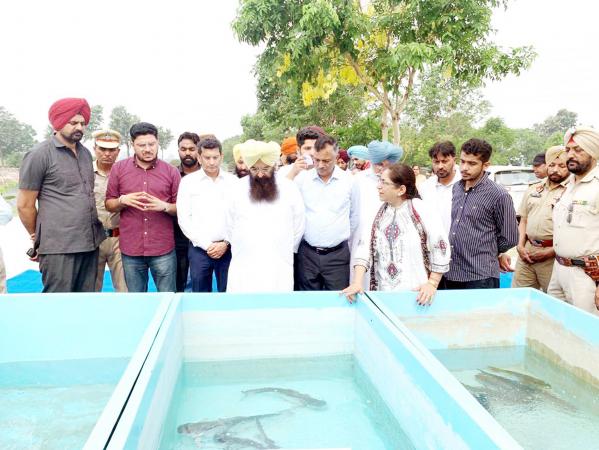 S. Gurmeet Singh Khudian Visiting Fisheries Farm along wtih vice chancellor and officers of the varsity